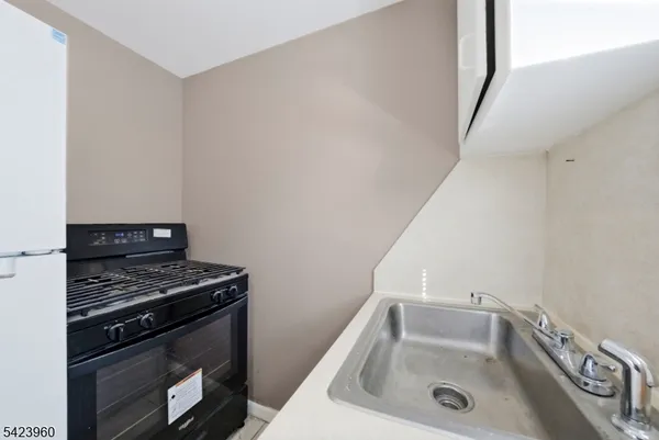 a bathroom with a sink and a stove