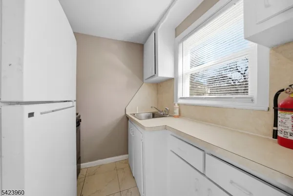 a kitchen with a sink and a window