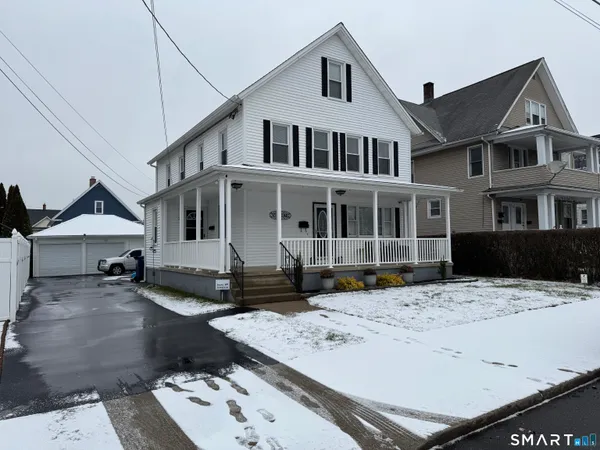 a view of a white building among the street side