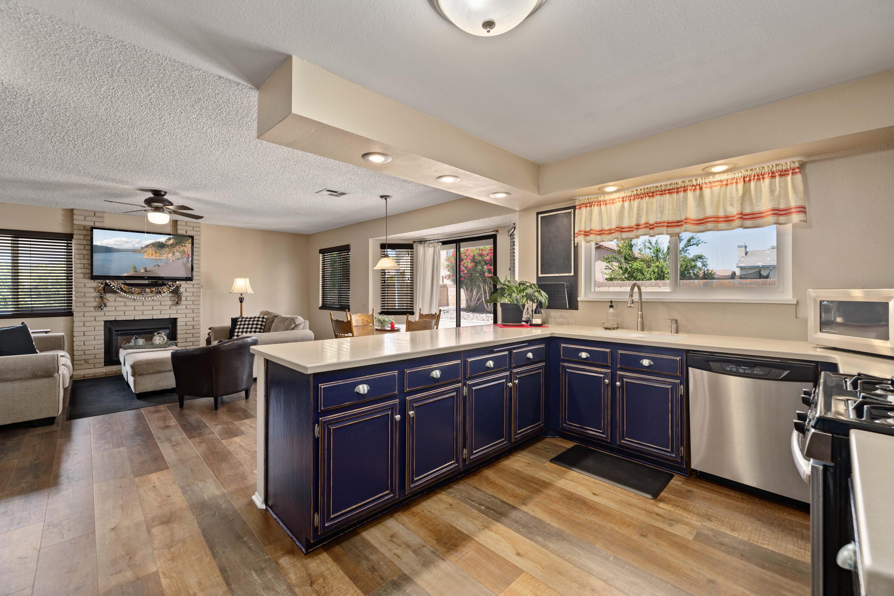 2833 Springfield Place Lancaster, CA 93536 - Photo 11 of 37 a large kitchen with cabinets and wooden floor