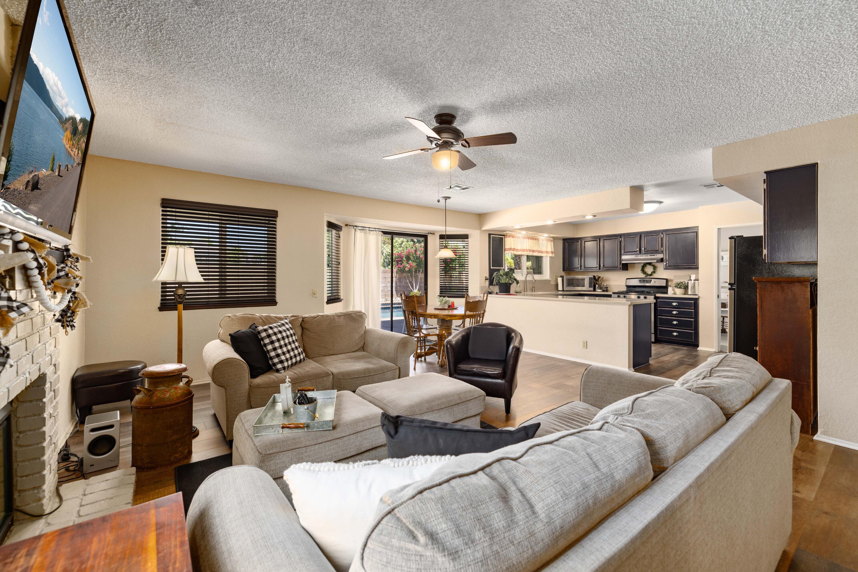 2833 Springfield Place Lancaster, CA 93536 - Photo 16 of 37 a living room with furniture kitchen view and a window