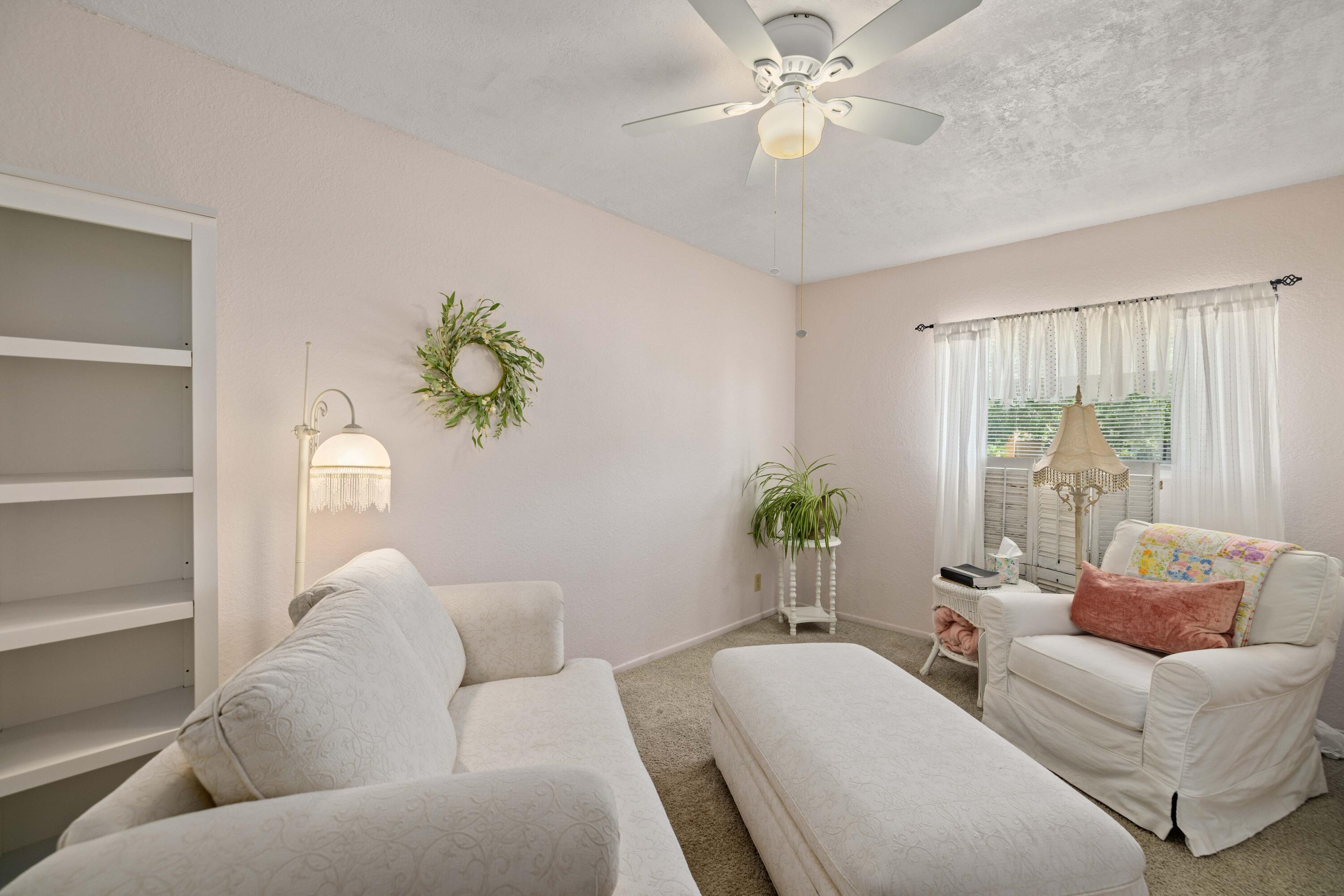 2833 Springfield Place Lancaster, CA 93536 - Photo 19 of 37 a living room with furniture and a potted plant