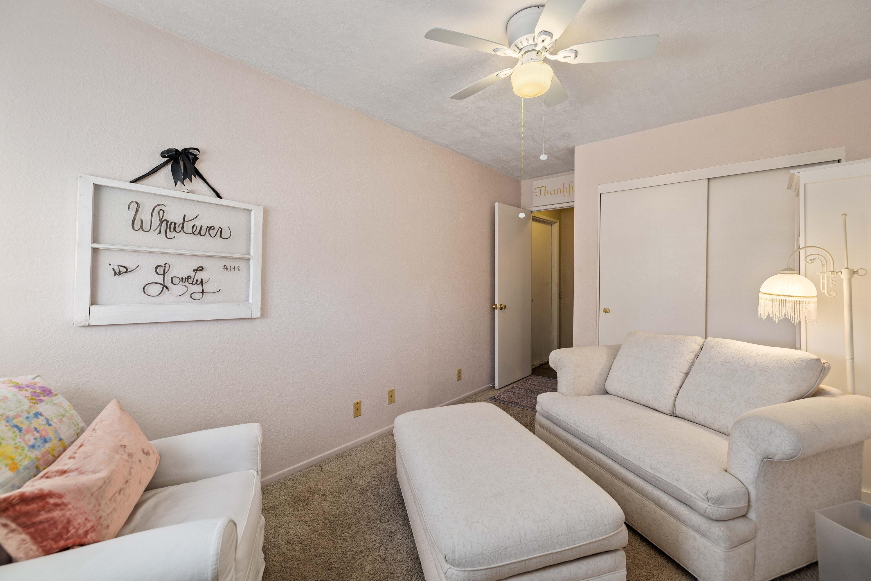 2833 Springfield Place Lancaster, CA 93536 - Photo 20 of 37 a living room with furniture and a couch