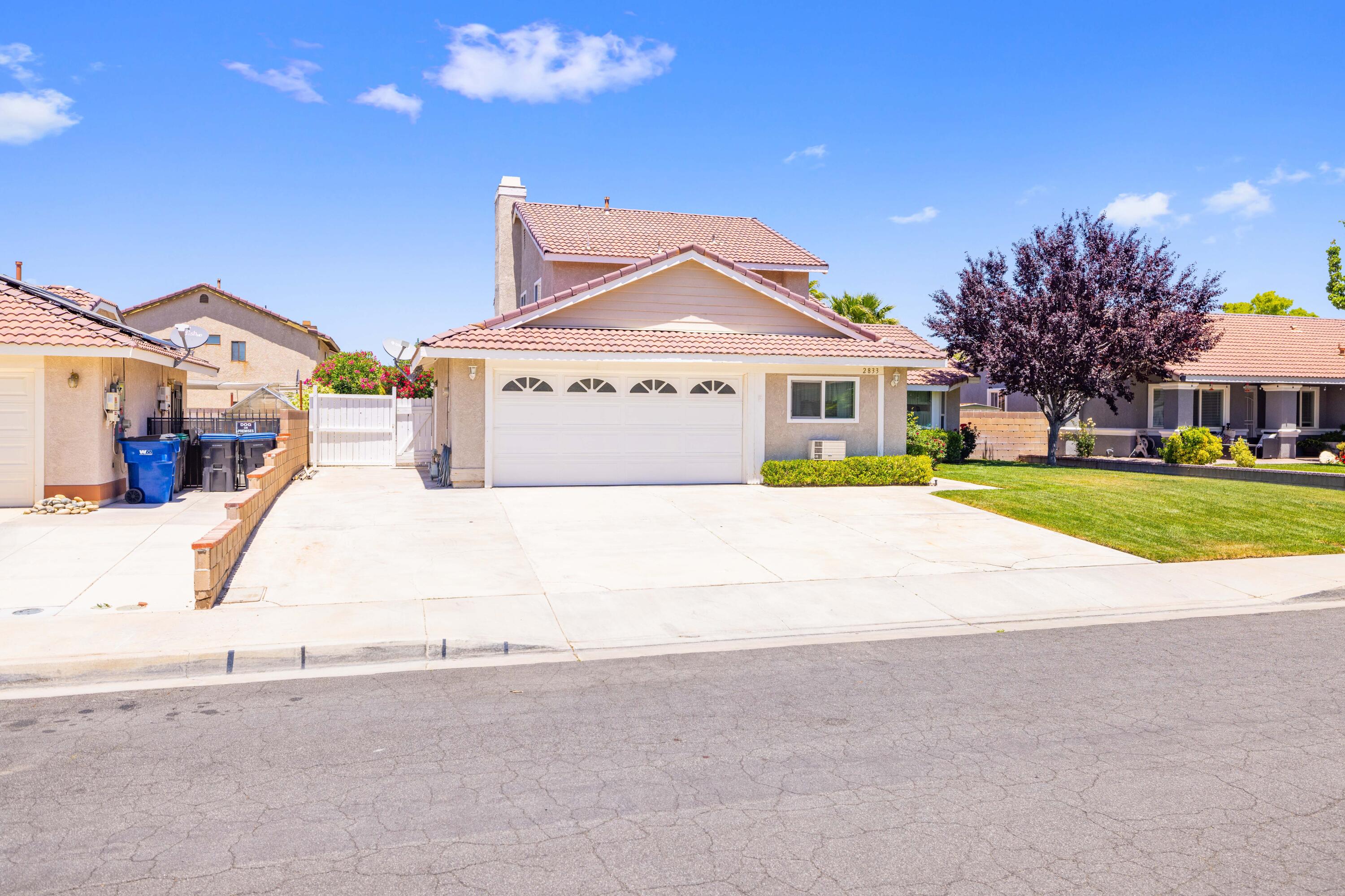 2833 Springfield Place Lancaster, CA 93536 - Photo 2 of 37 a view of house with outdoor space and parking