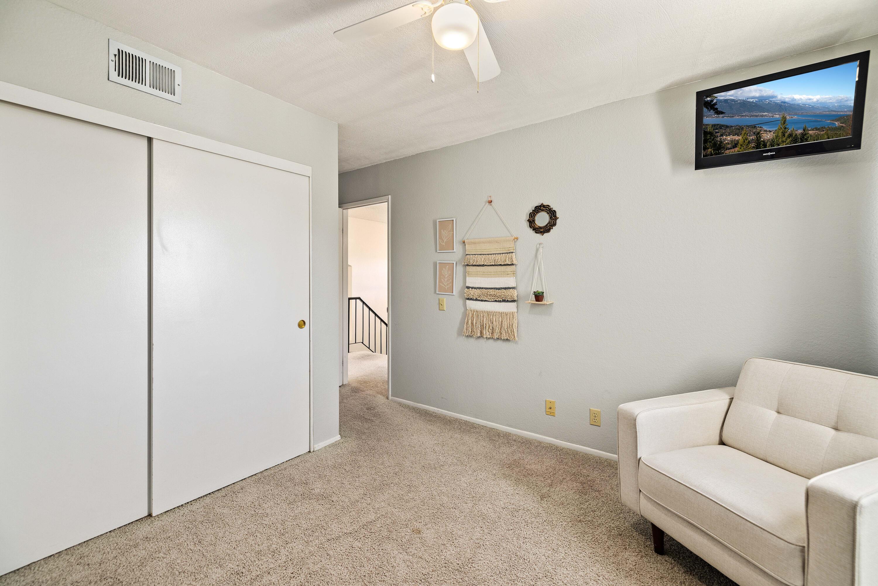 2833 Springfield Place Lancaster, CA 93536 - Photo 24 of 37 a living room with furniture and a flat screen tv