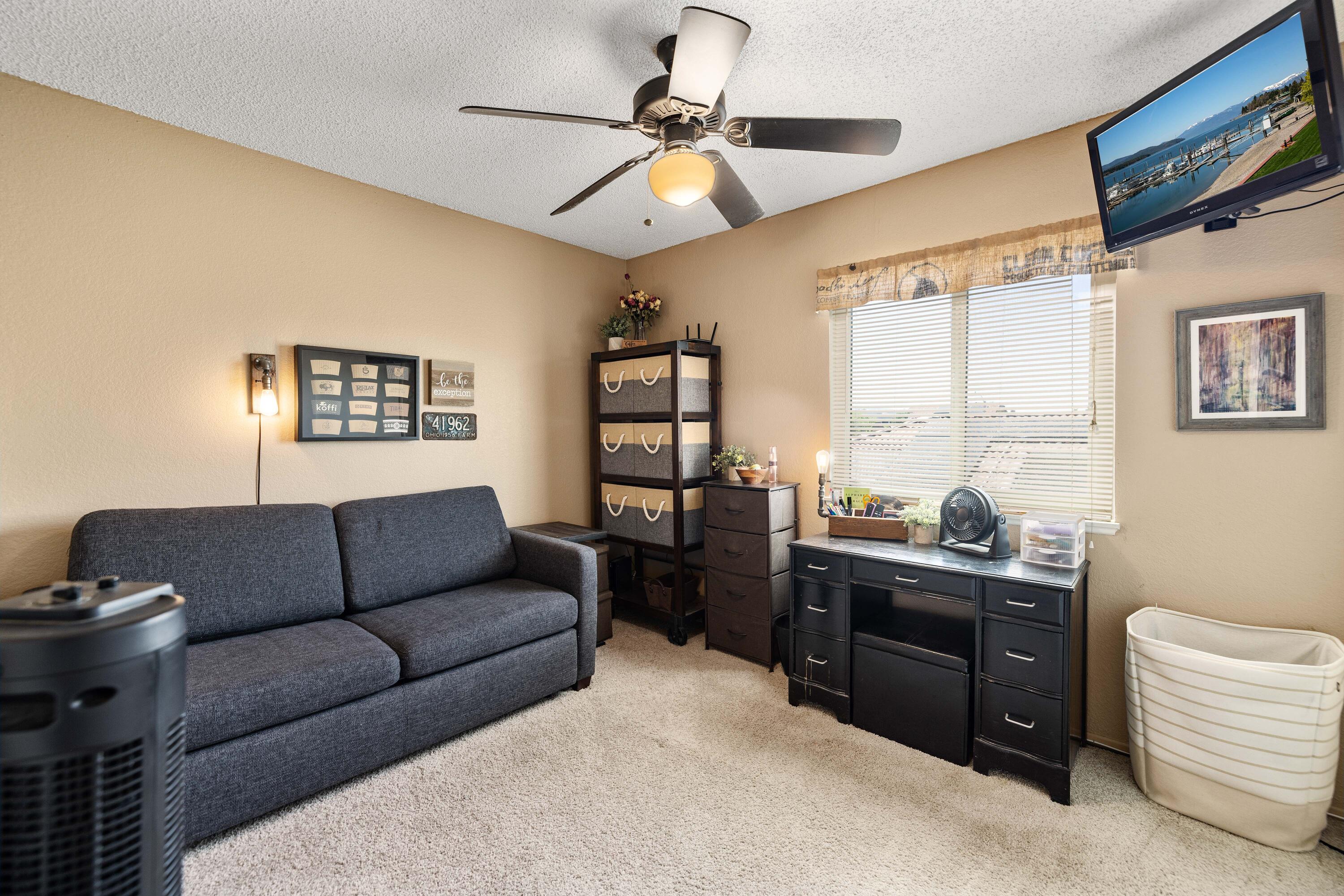 2833 Springfield Place Lancaster, CA 93536 - Photo 25 of 37 a living room with furniture and a window