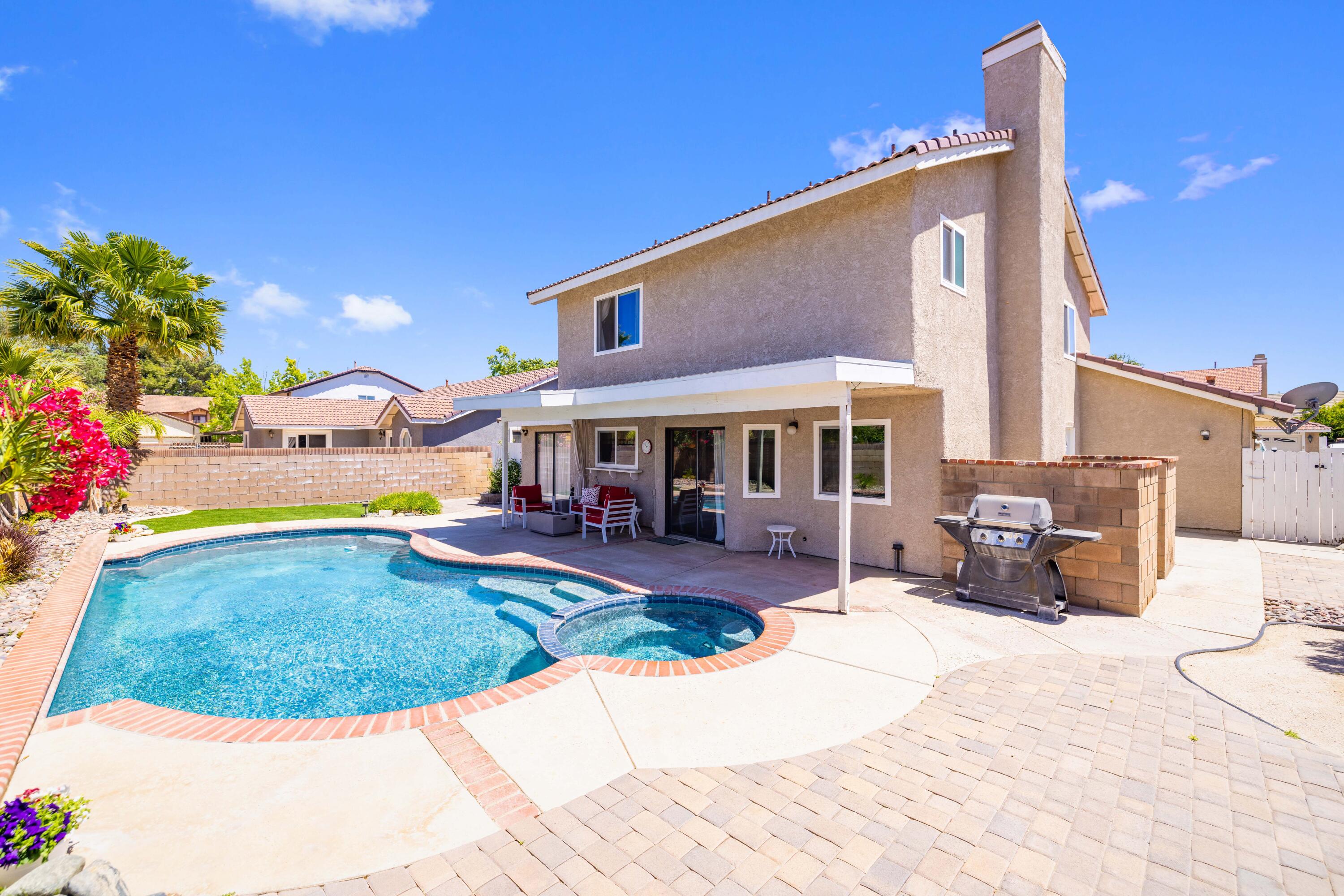 2833 Springfield Place Lancaster, CA 93536 - Photo 32 of 37 a view of a house with swimming pool and sitting area
