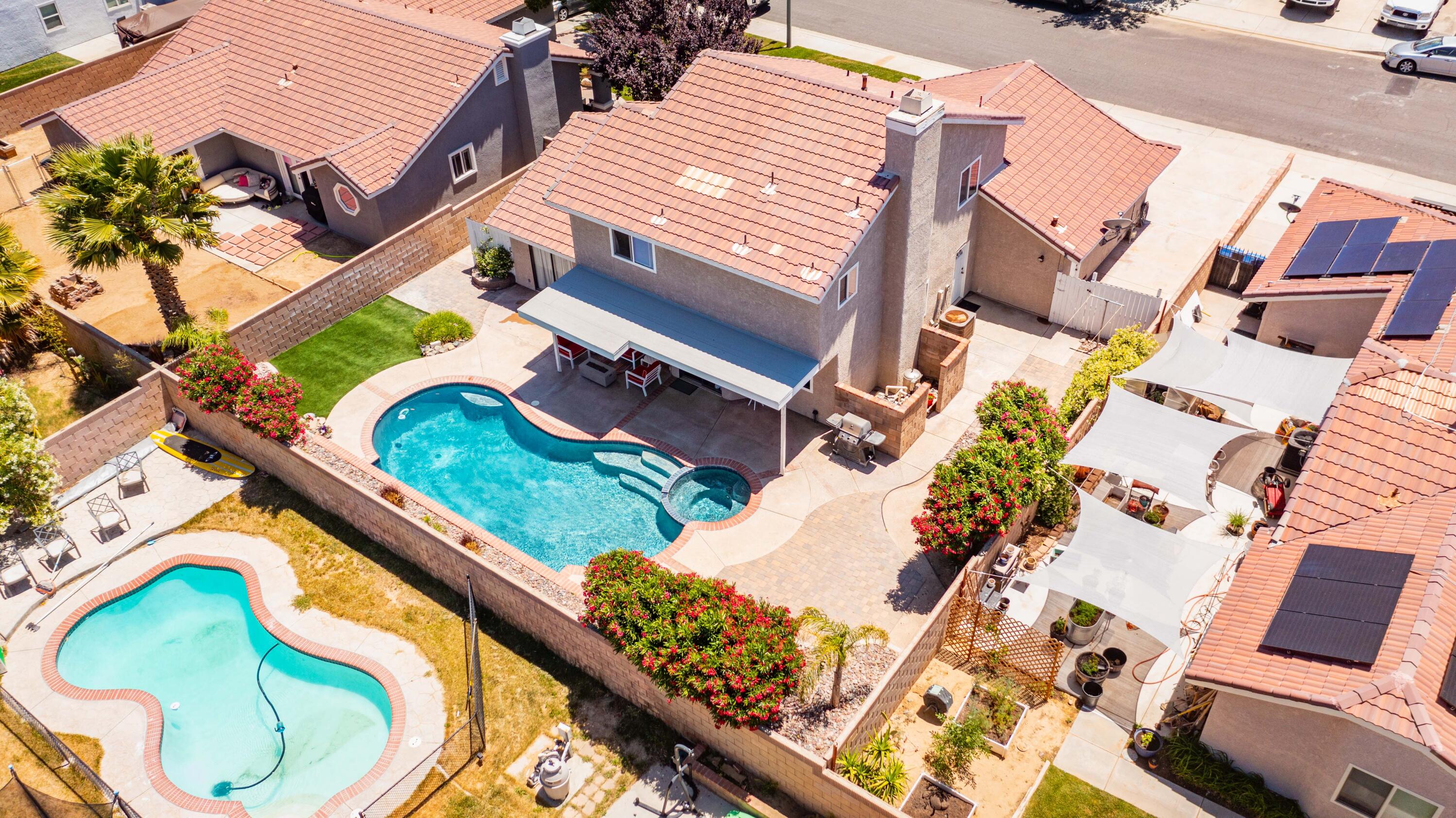 2833 Springfield Place Lancaster, CA 93536 - Photo 37 of 37 an aerial view of a house with a garden and swimming pool