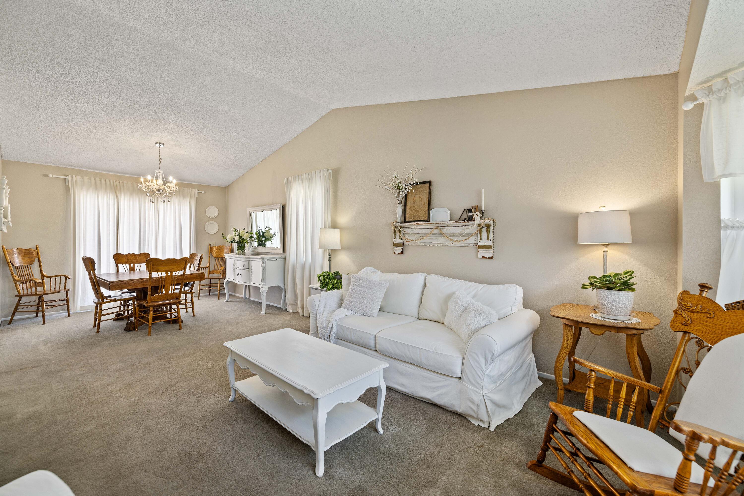 2833 Springfield Place Lancaster, CA 93536 - Photo 4 of 37 a living room with furniture and a table