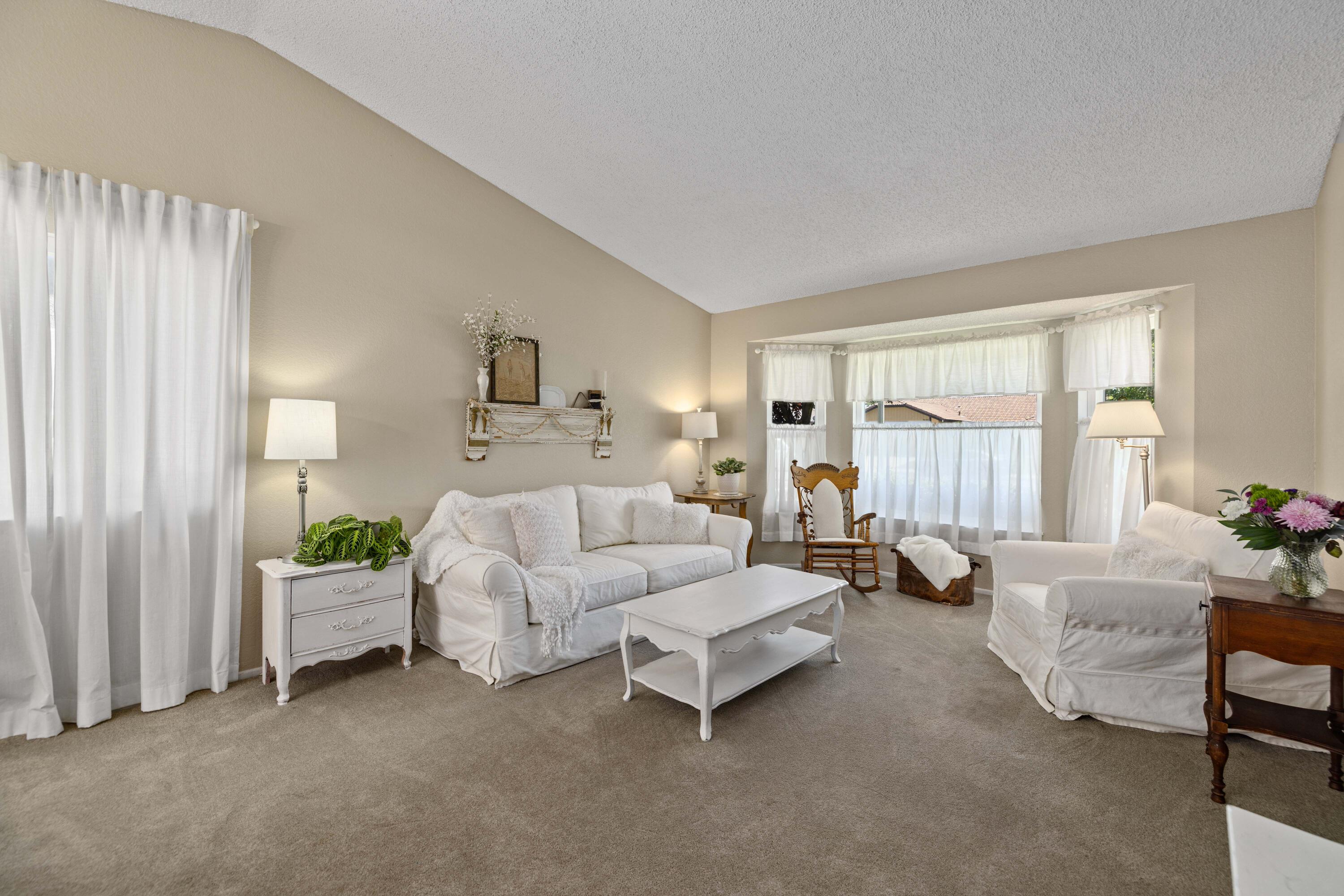 2833 Springfield Place Lancaster, CA 93536 - Photo 7 of 37 a living room with furniture and a large window