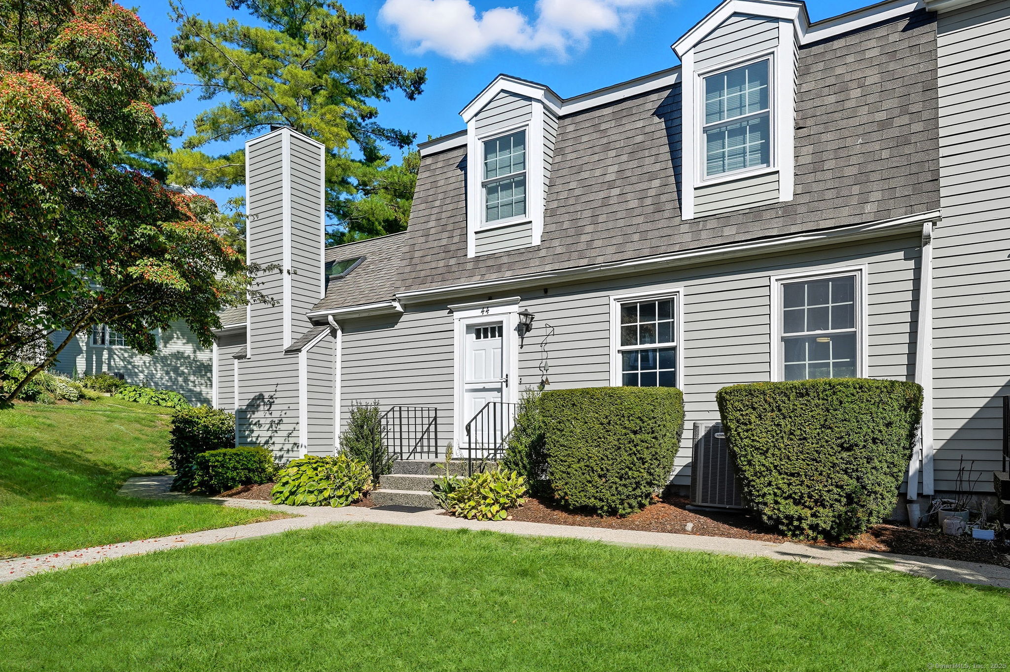 a front view of a house with a yard