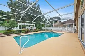 a view of a swimming pool with a yard