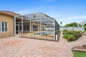 a view of a house with backyard and garden