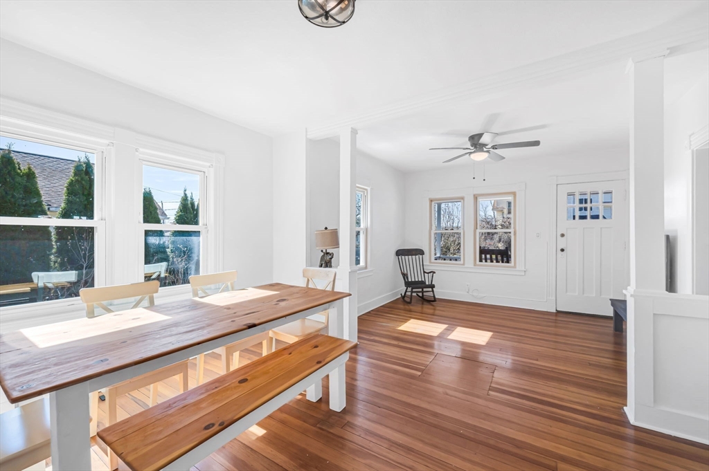 83 Mazarin Street Springfield, MA 01151 - Photo 16 of 25 a living room with kitchen island granite countertop wooden floor and a window