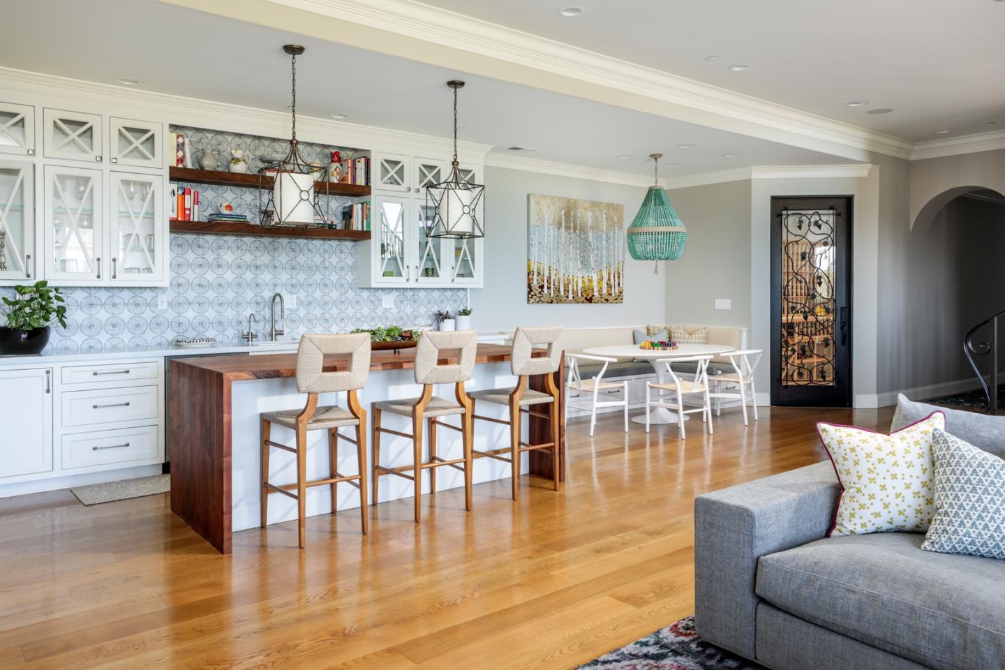 883 Robb Road Palo Alto, CA 94306 - Photo 20 of 33 a living room kitchen with white cabinets and wooden floor