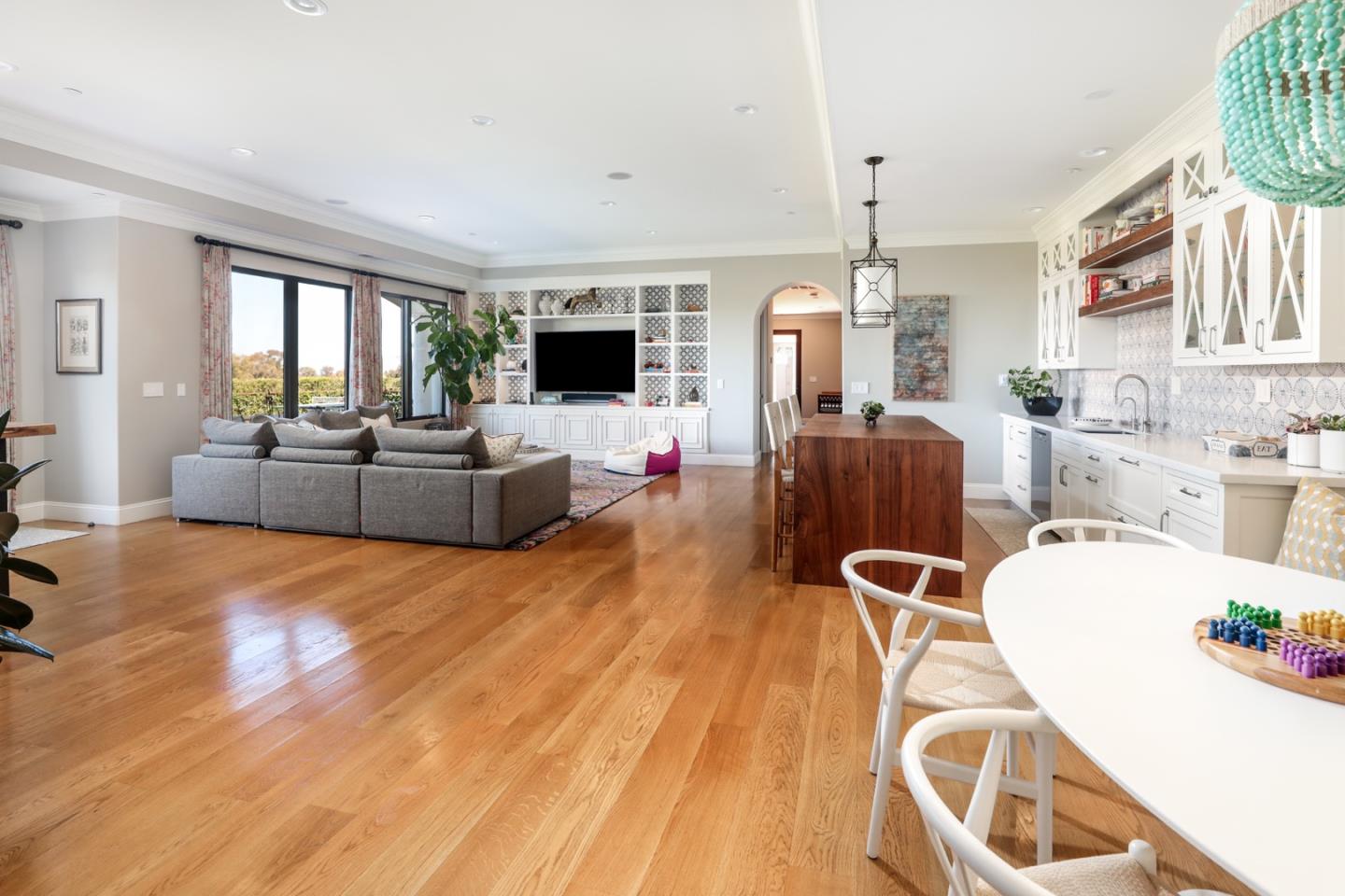 883 Robb Road Palo Alto, CA 94306 - Photo 24 of 33 a living room with furniture a flat screen tv and a large window
