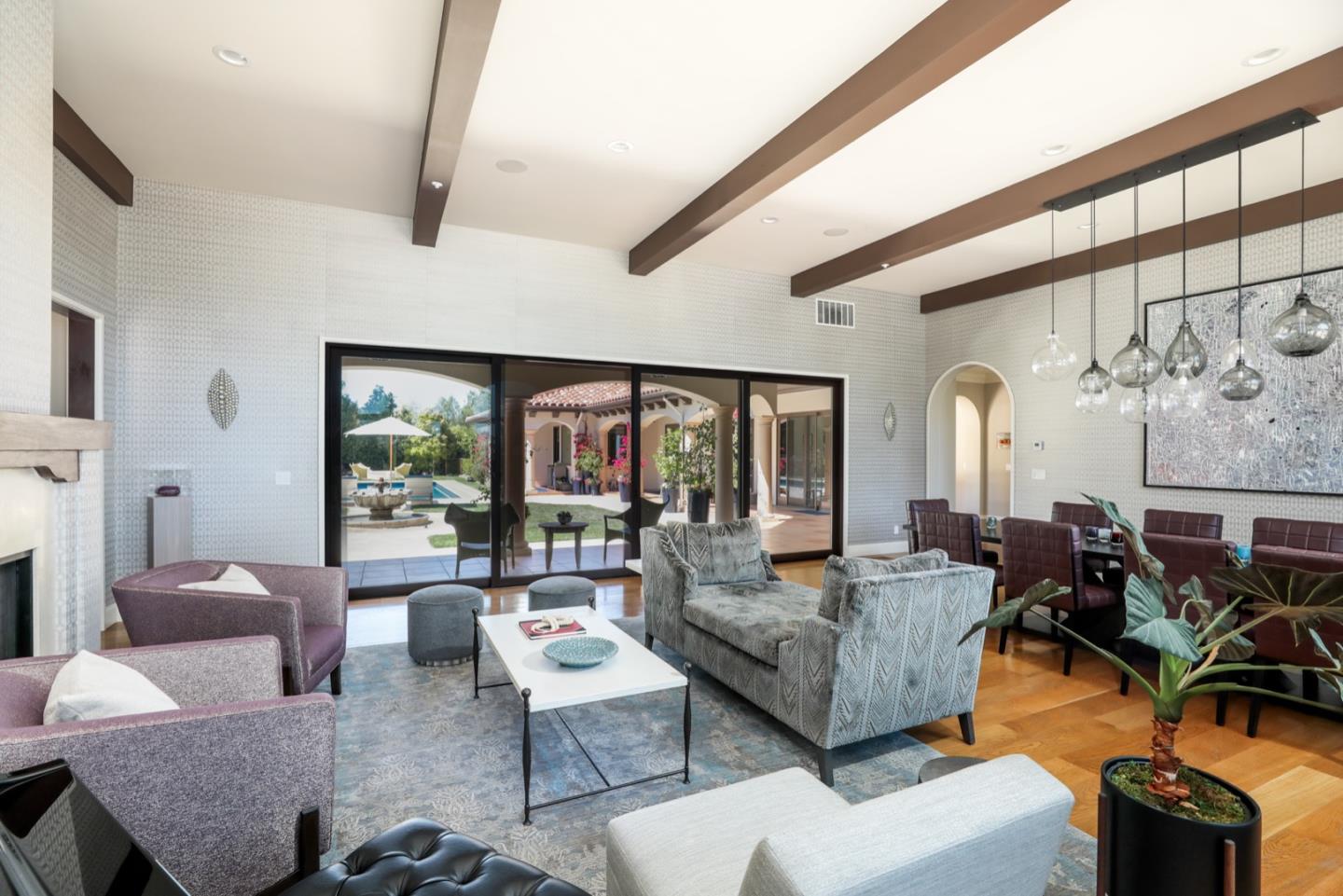 883 Robb Road Palo Alto, CA 94306 - Photo 28 of 33 a living room with furniture and floor to ceiling windows