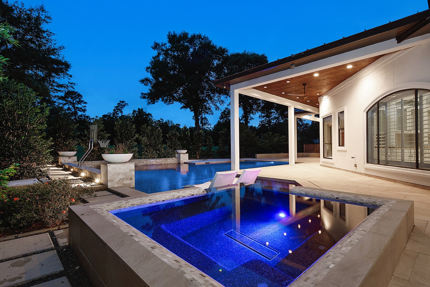 70 Quail Rock Place The Woodlands, TX 77381 - Photo 40 of 46 a view of a patio with swimming pool table and chairs