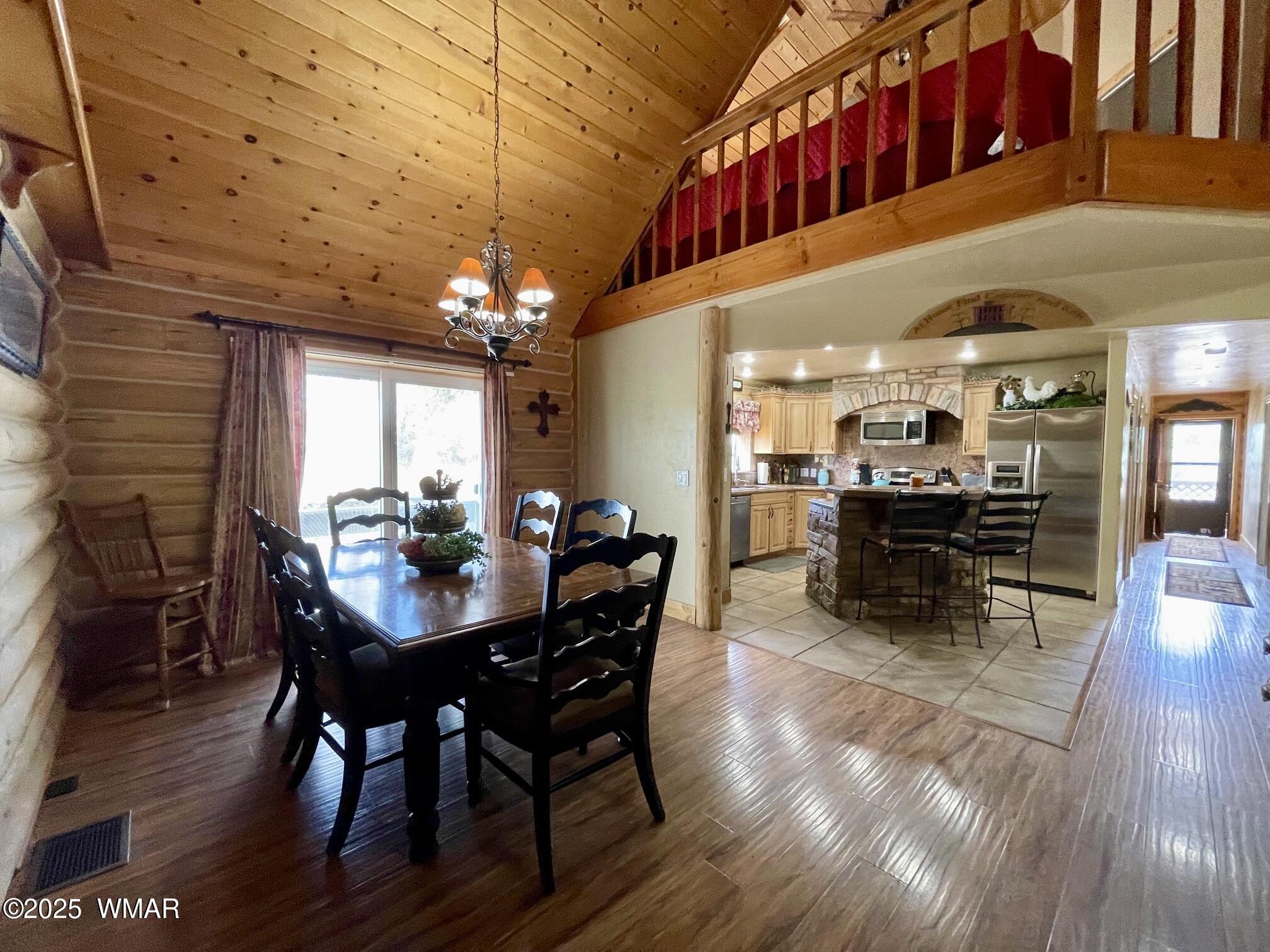 183 North Becker Lake Road Springerville, AZ 85938 - Photo 10 of 41 a view of a dining room with furniture and wooden floor