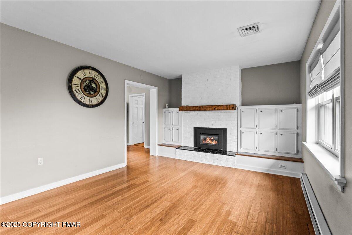 1215 Country Club Road Clarks Summit, PA 18411 - Photo 11 of 50 a view of a livingroom with a fireplace and a window