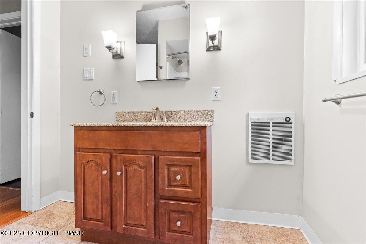1215 Country Club Road Clarks Summit, PA 18411 - Photo 17 of 50 a bathroom with a sink and a mirror