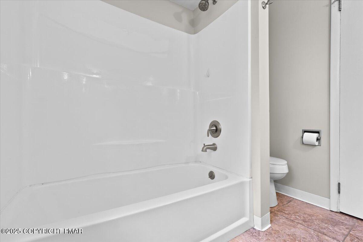 1215 Country Club Road Clarks Summit, PA 18411 - Photo 18 of 50 a bathroom with a bathtub and a toilet