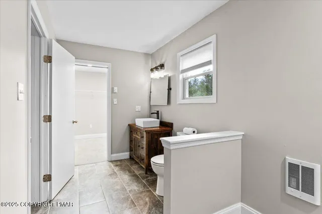 a view of a room with racks on the wall