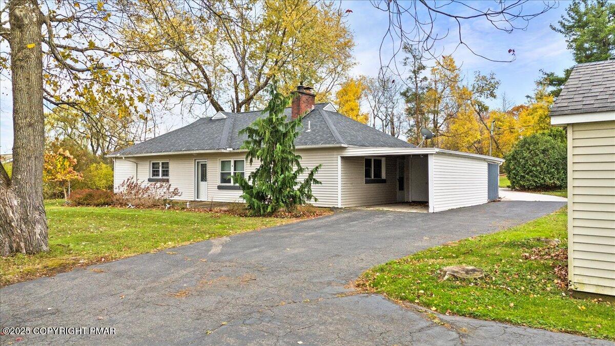 1215 Country Club Road Clarks Summit, PA 18411 - Photo 3 of 50 front view of a house with a yard and an trees