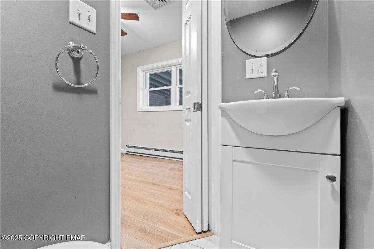 1215 Country Club Road Clarks Summit, PA 18411 - Photo 35 of 50 a bathroom with a sink and a mirror