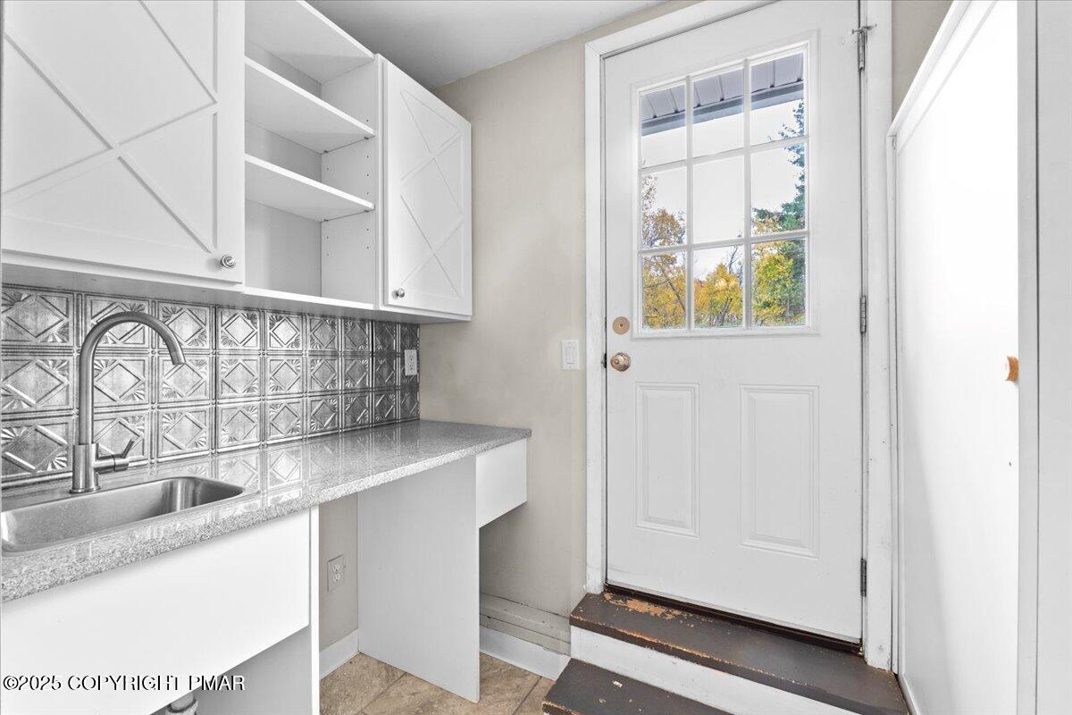 1215 Country Club Road Clarks Summit, PA 18411 - Photo 39 of 50 a view of a kitchen sink with a granite countertop