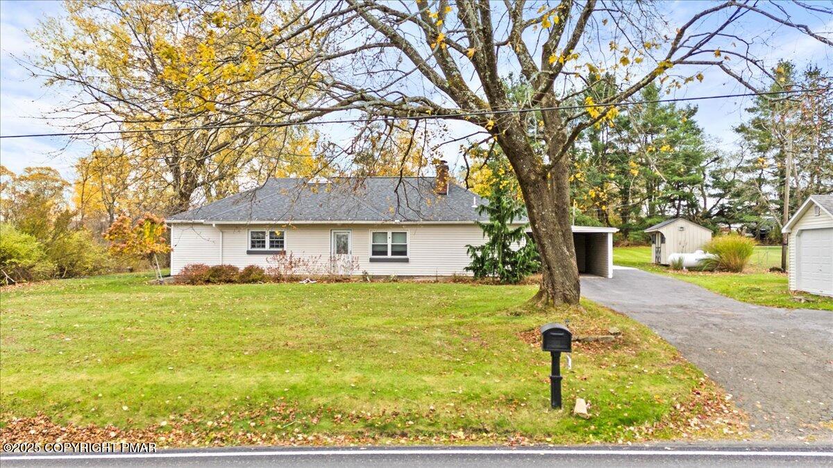 1215 Country Club Road Clarks Summit, PA 18411 - Photo 4 of 50 front view of a house with a yard