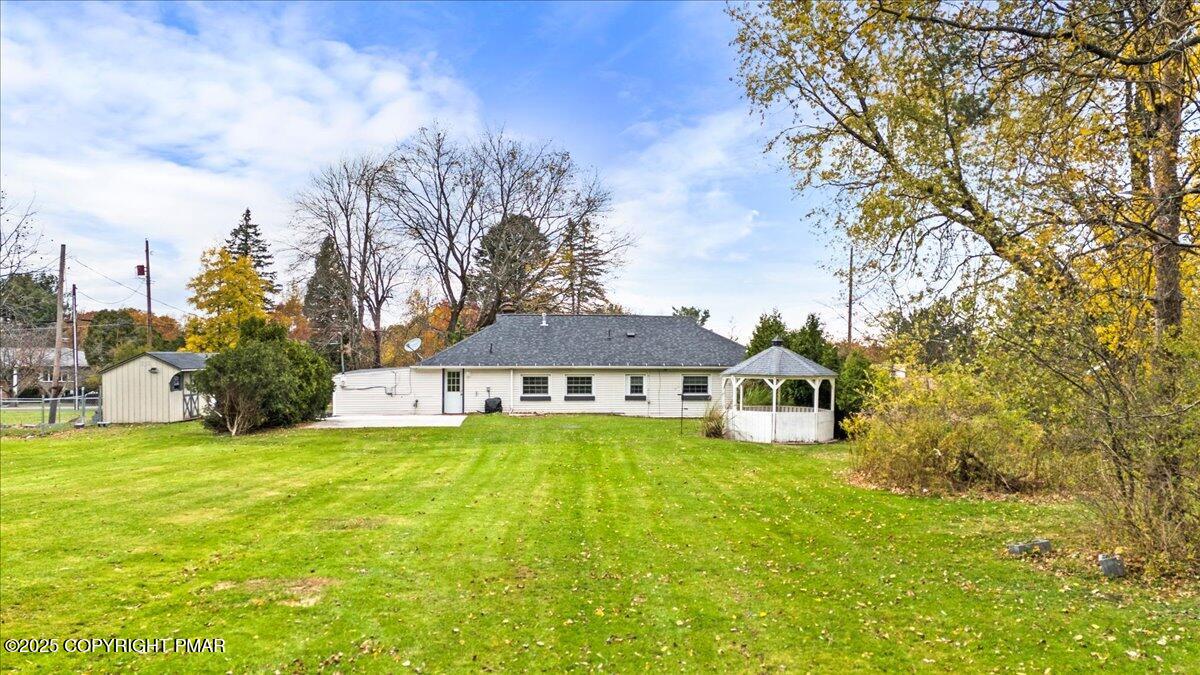 1215 Country Club Road Clarks Summit, PA 18411 - Photo 42 of 50 a view of a house with a big yard and large trees