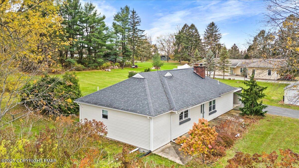 1215 Country Club Road Clarks Summit, PA 18411 - Photo 6 of 50 a aerial view of a house with a yard table and chairs