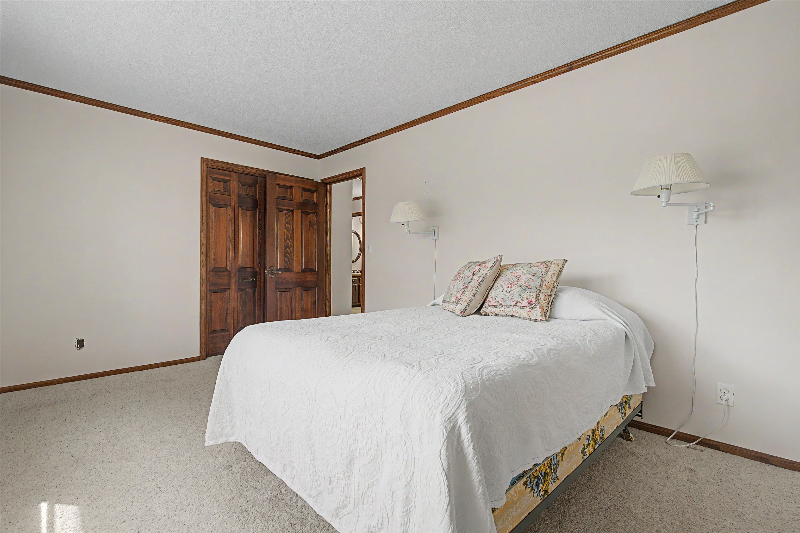 17380 Corbett Road Mount Carroll, IL 61053 - Photo 20 of 65 a bedroom with a bed and a window