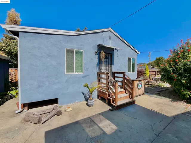 a kitchen with stainless steel appliances a refrigerator a sink a stove top oven and cabinets