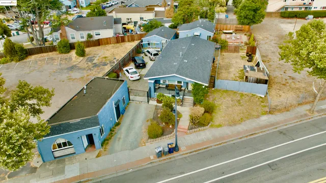 an aerial view of residential houses with outdoor space