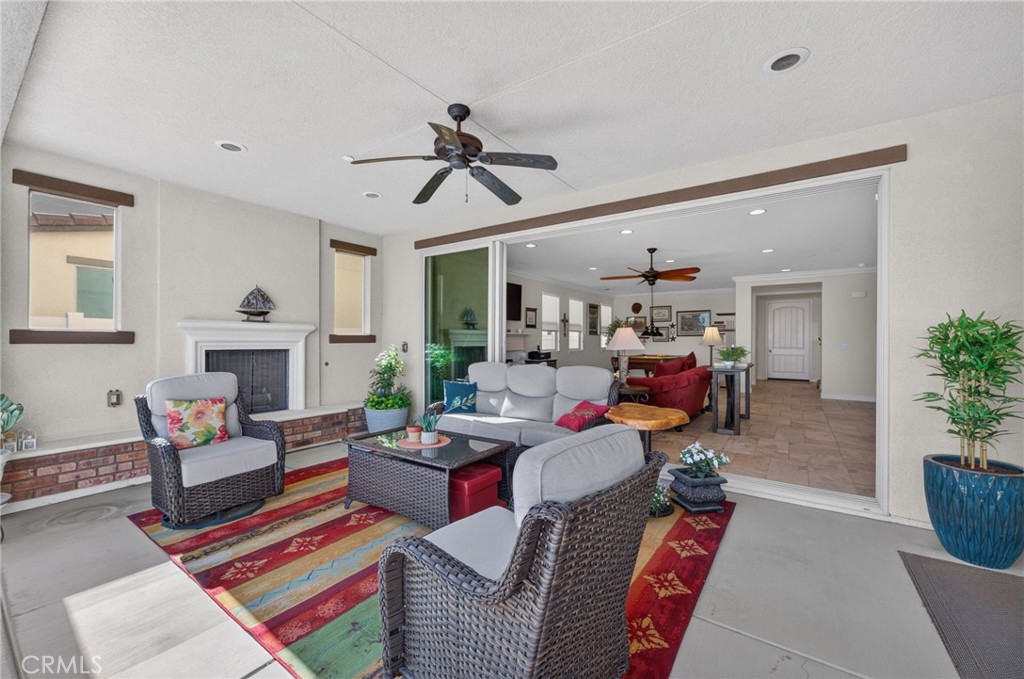 31749 Country View Road Temecula, CA 92591 - Photo 13 of 68 a living room with furniture fireplace and a potted plant