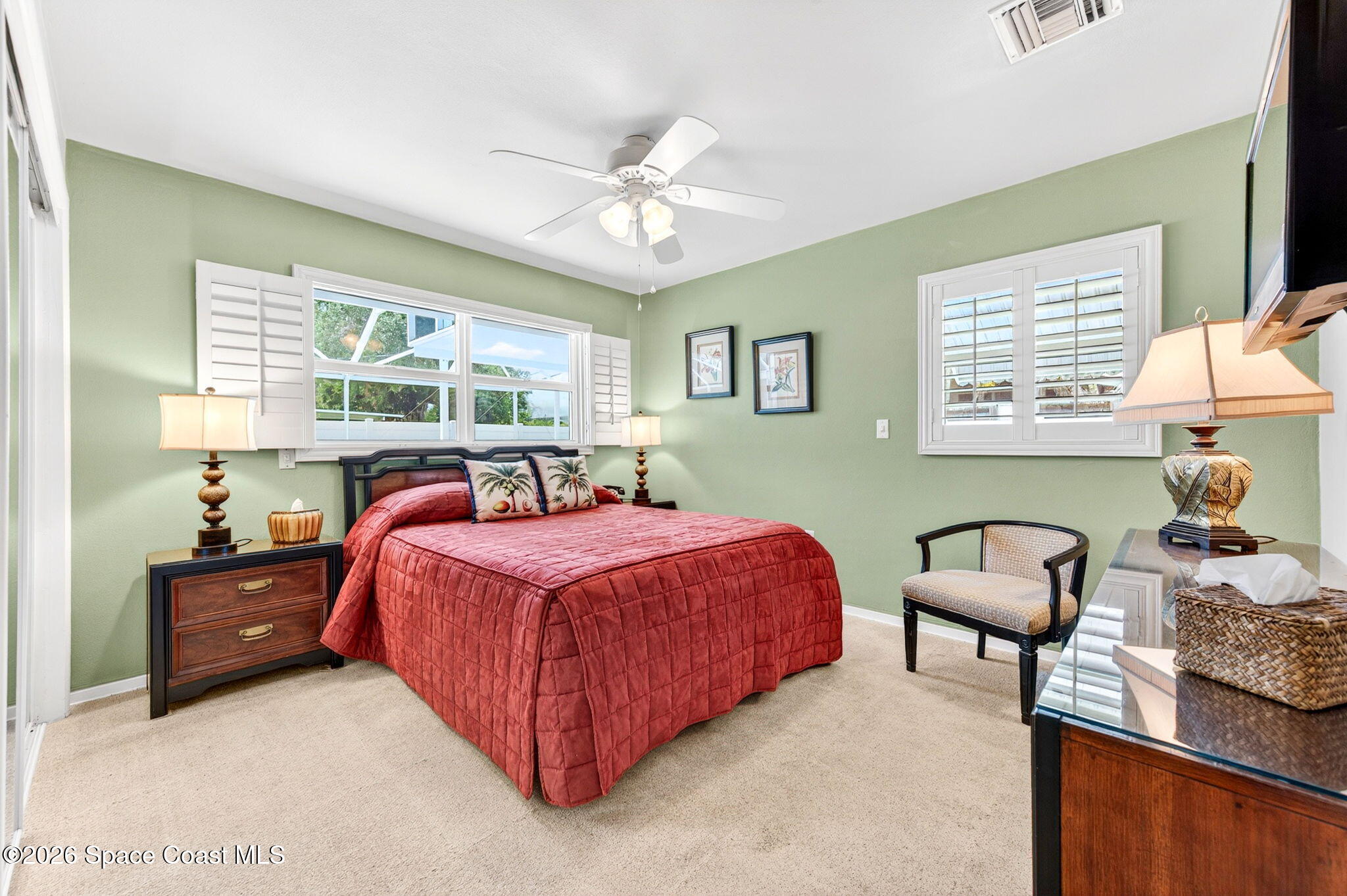 935 Samar Road Cocoa Beach, FL 32931 - Photo 14 of 22 a spacious bedroom with a bed and window