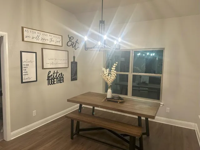 a view of a hallway with seating area