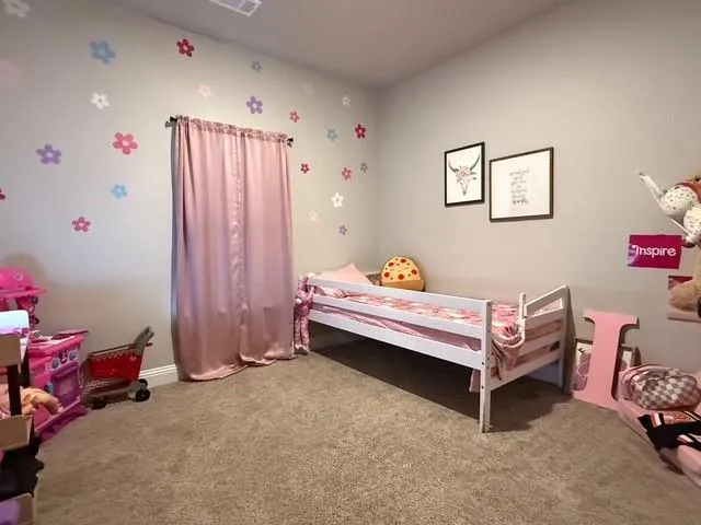 a bedroom with furniture and a chandelier