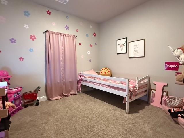 F1201 Sanger Drive Springtown, TX 76082 - Photo 5 of 11 a bedroom with furniture and a chandelier