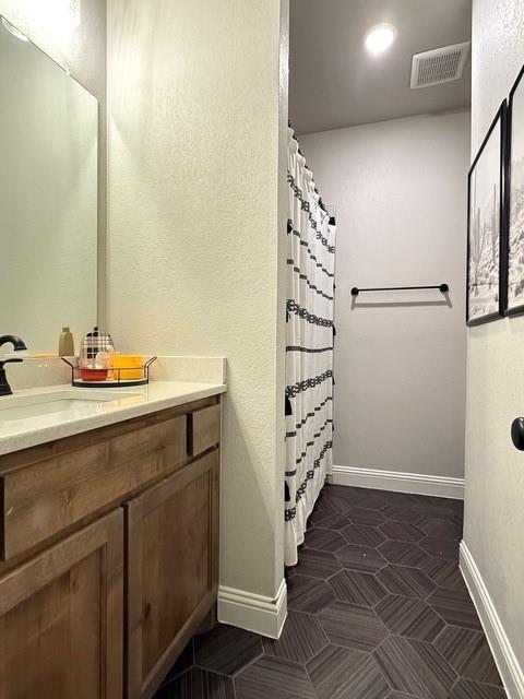 F1201 Sanger Drive Springtown, TX 76082 - Photo 7 of 11 a bathroom with a sink a mirror and shower