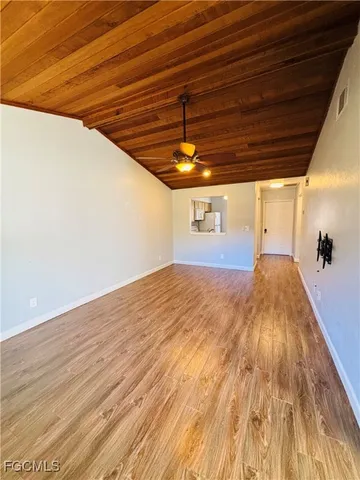 a bathroom with a sink a toilet a mirror and shower