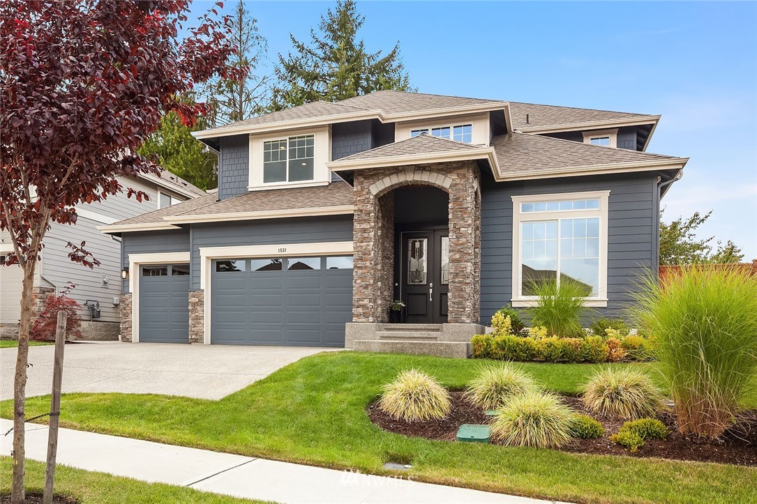 1531 Jericho Place Northeast Renton, WA 98059 - Photo 1 of 1 a front view of a house with garden