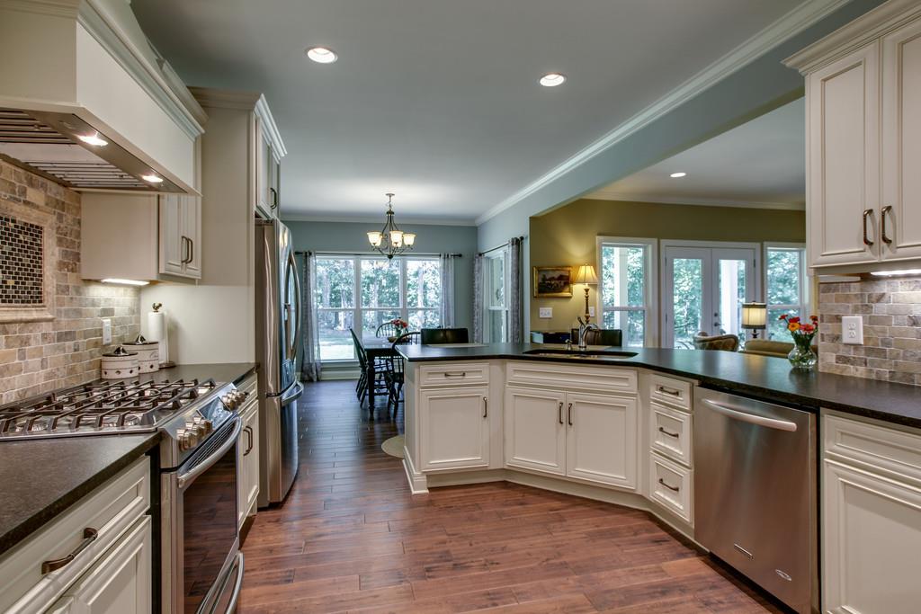 7901 Pinewood Road Fairview, TN 37062 - Photo 13 of 30 a kitchen with lots of counter top space and stainless steel appliances