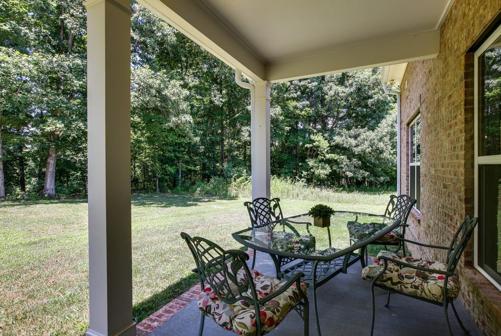 7901 Pinewood Road Fairview, TN 37062 - Photo 27 of 30 a view of an outdoor sitting area with furniture and backyard
