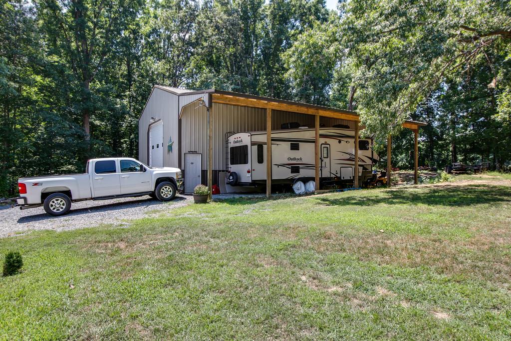 7901 Pinewood Road Fairview, TN 37062 - Photo 29 of 30 a view of a house with a big yard and large trees