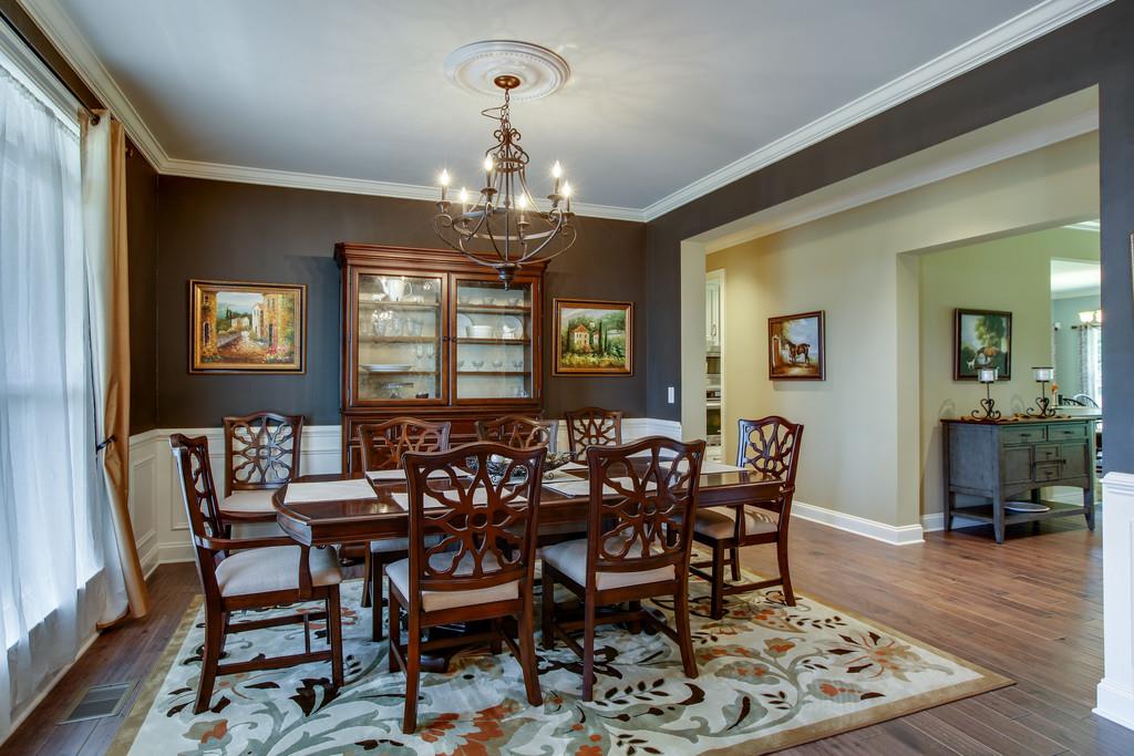 7901 Pinewood Road Fairview, TN 37062 - Photo 4 of 30 a view of a dining room with furniture wooden floor and chandelier
