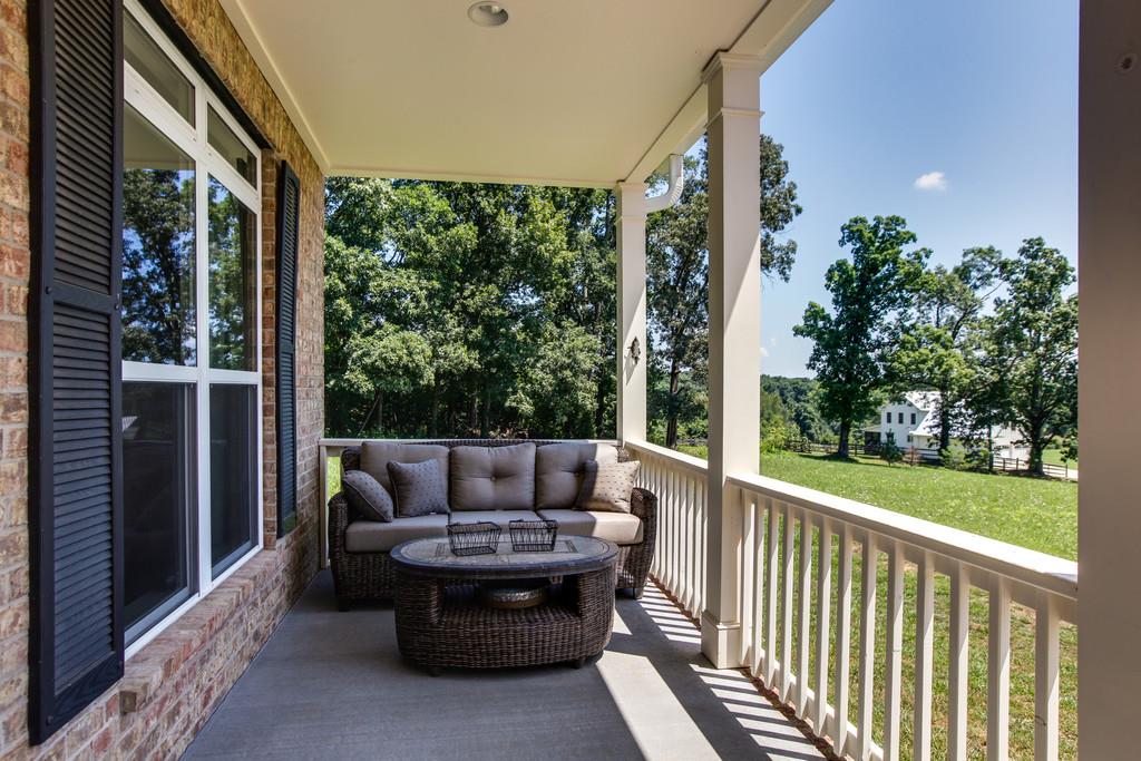 7901 Pinewood Road Fairview, TN 37062 - Photo 5 of 30 a view of balcony with couch and outdoor space