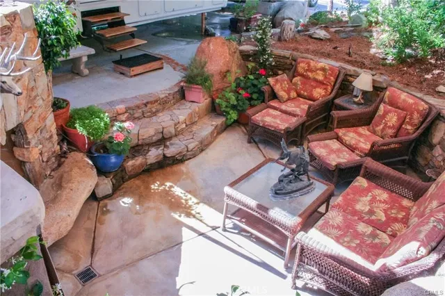 an aerial view of a backyard with outdoor seating